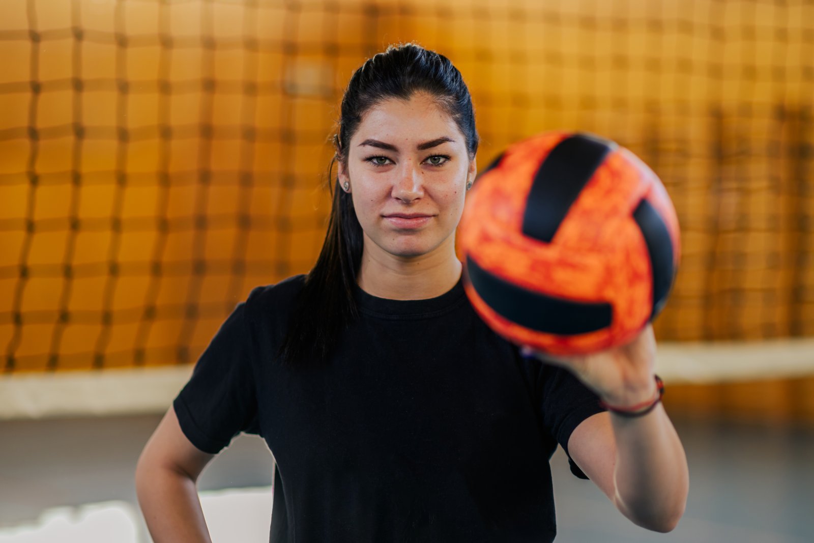 a teenage volleyball player on court showing a bal 2024 02 19 22 32 01 utc