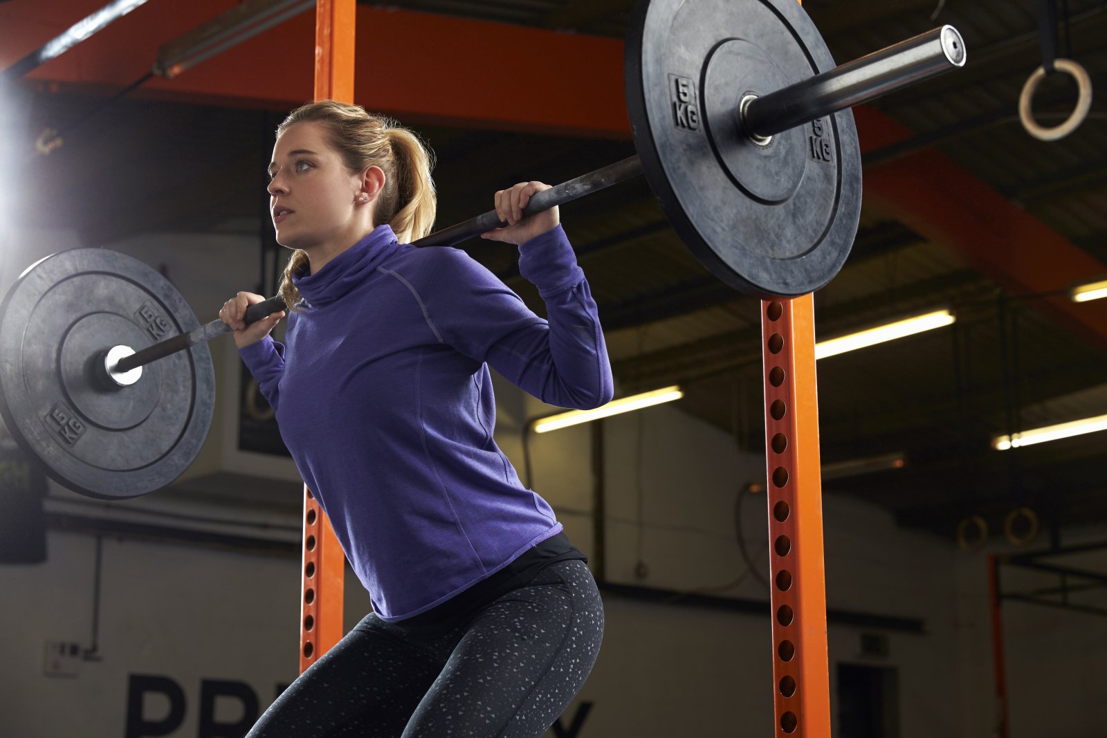 woman in gym lifting weights on barbell 2024 10 20 05 21 05 utc